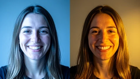 The same smiling woman shown twice side by side, lit by cool blue daylight on the left and a warm yellow indoor lamp on the right, illustrating mismatched lighting in a composite. Her face and skin shift color noticeably between the two versions. A plain grey studio backdrop sits behind both. Hard daylight from a window strikes the left face while a soft warm bulb glows on the right. Comparative, analytical, photo-tutorial tone.